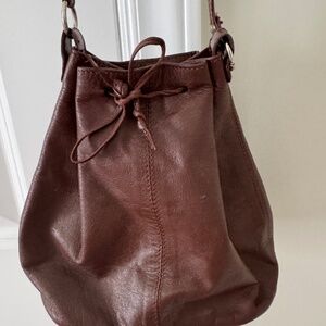 Leather mini sling purse with tie closure